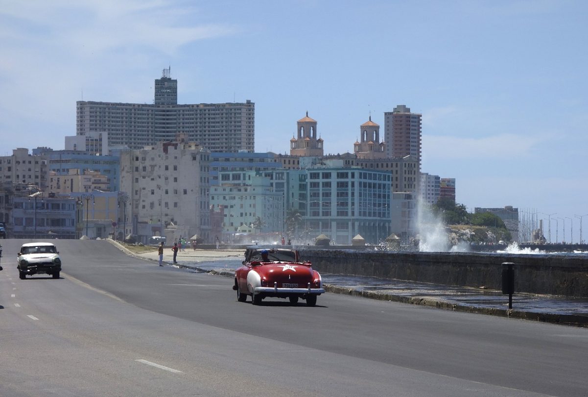 Car driving down malecon in Cuba