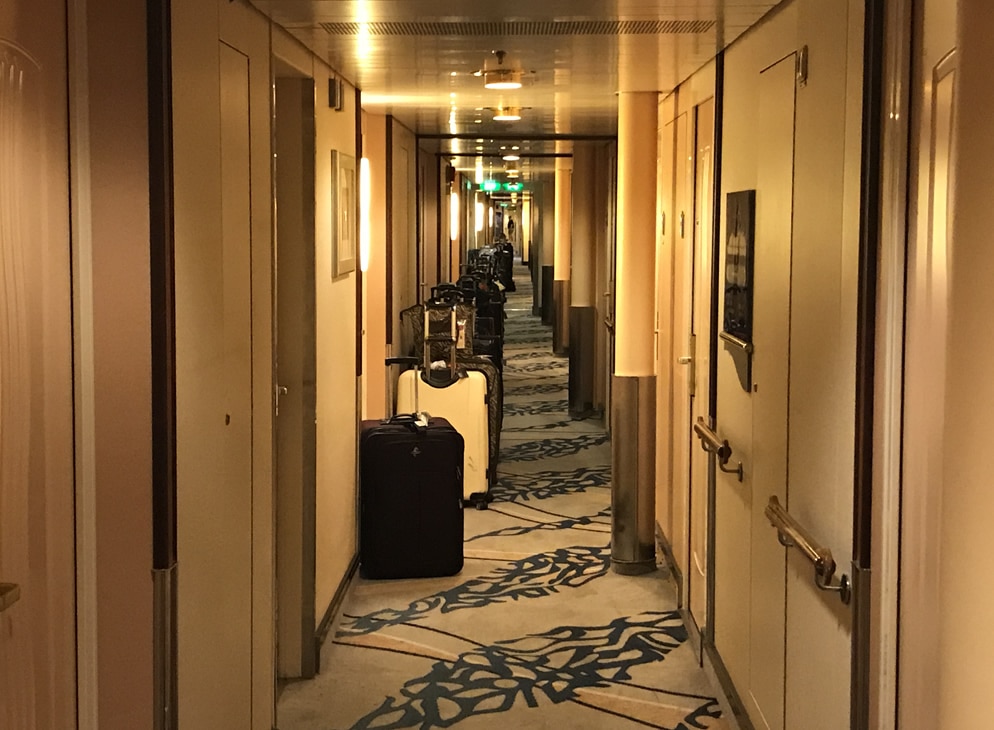 Suitcases in cruise hallway